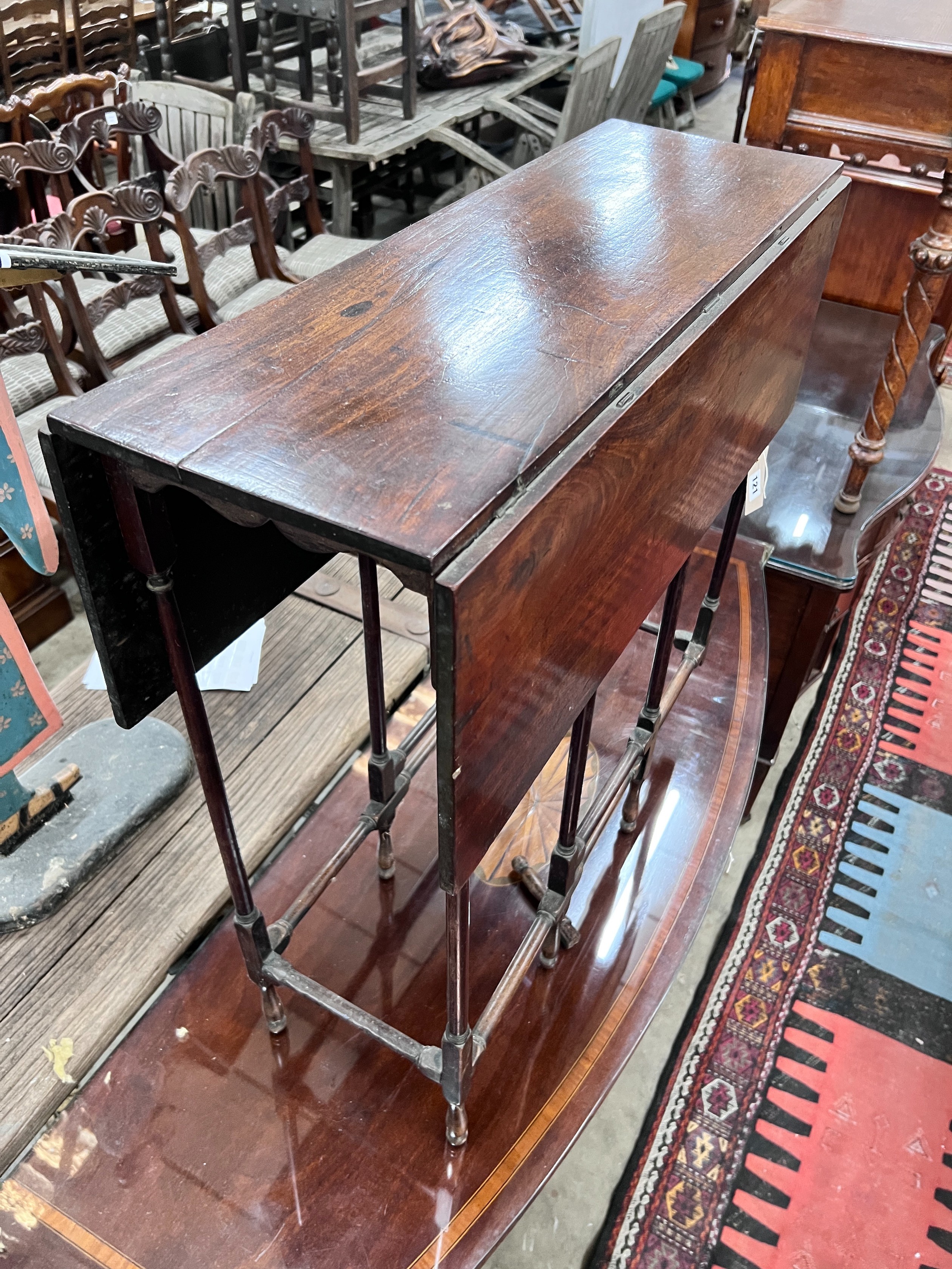 A mahogany spider leg table, width 71cm, depth 27cm, height 71cm *Please note the sale commences at 9am.